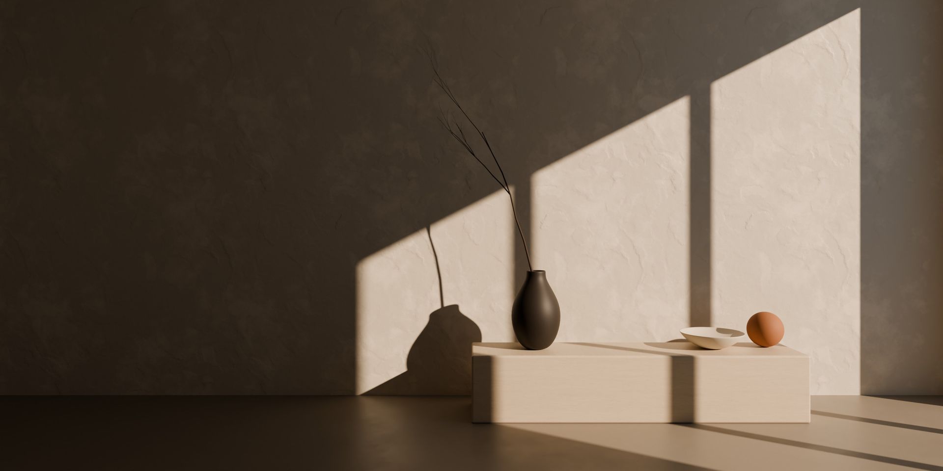 Concept render: late sunlight falls through a tall window in three slanted panels across a softly trowelled mineral wall, above a low stone bench with a dark ceramic vessel and a dry branch.